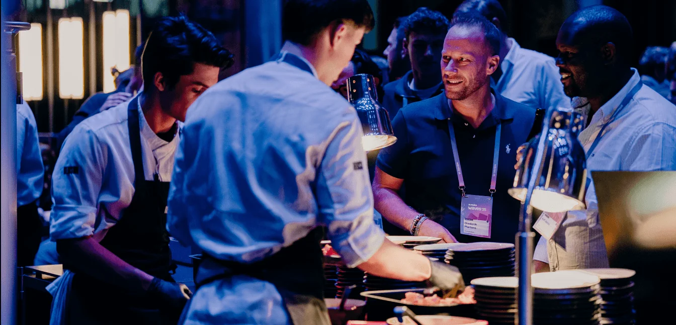 Chefs plating food at a Waves evening reception